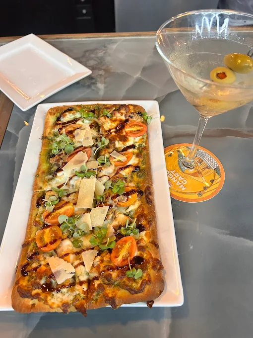 Pesto flatbread paired with a dirty martini at Starlite Bistro